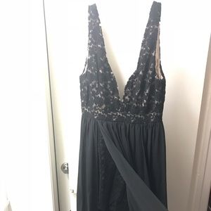 Long black dress with lace/slit down one thigh.